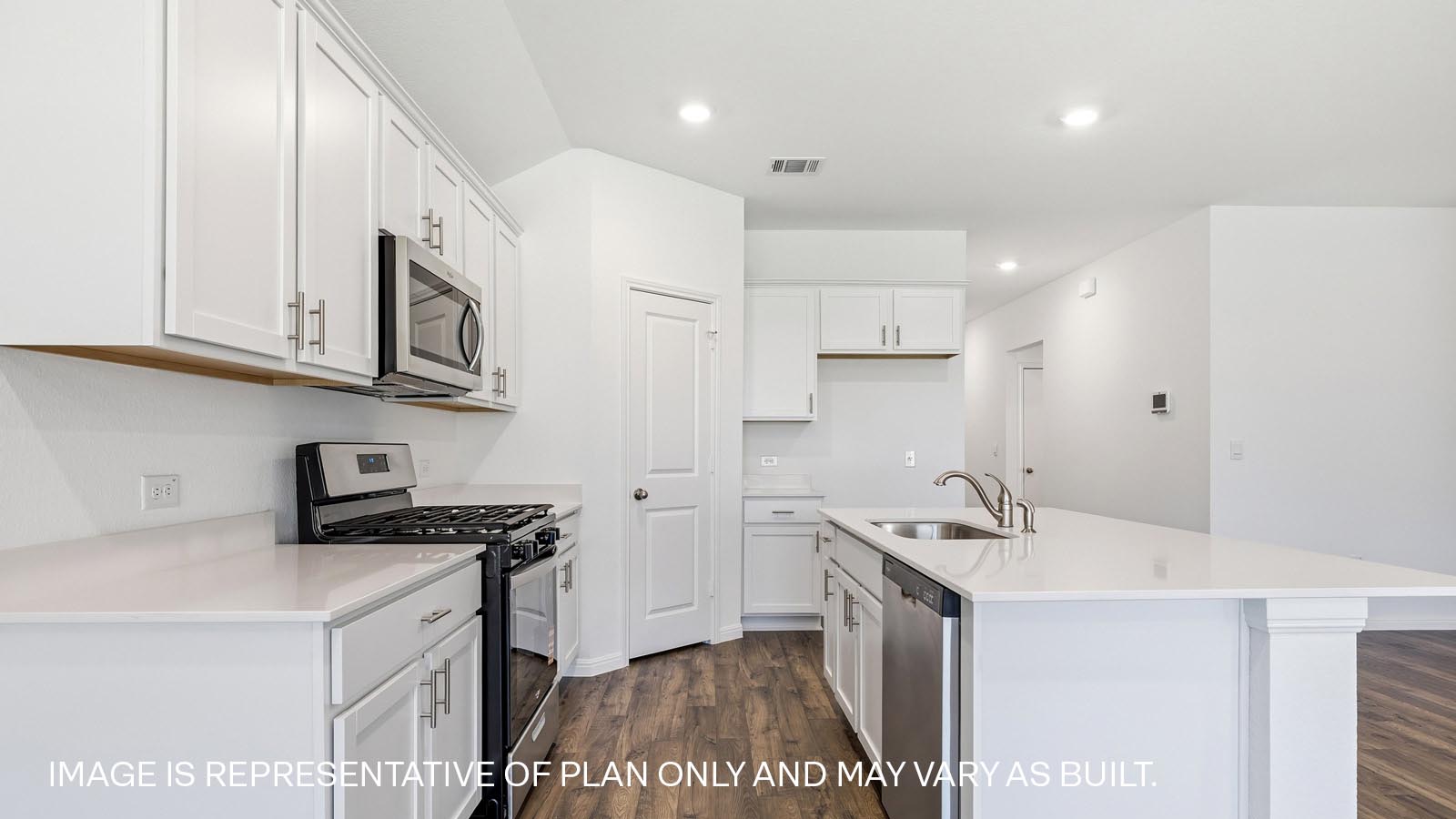 Stainless steel gas range and microwave.