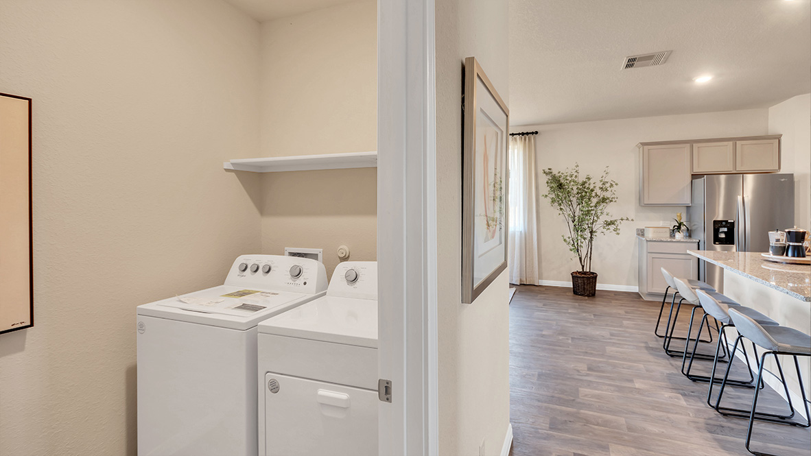 laundry room next to the kitchen