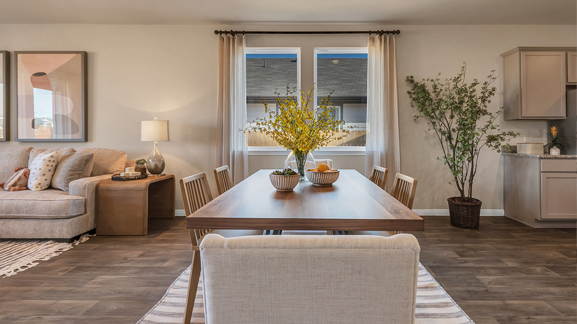 dining room off of the kitchen featuring rectangular table with 6 chairs surrounding