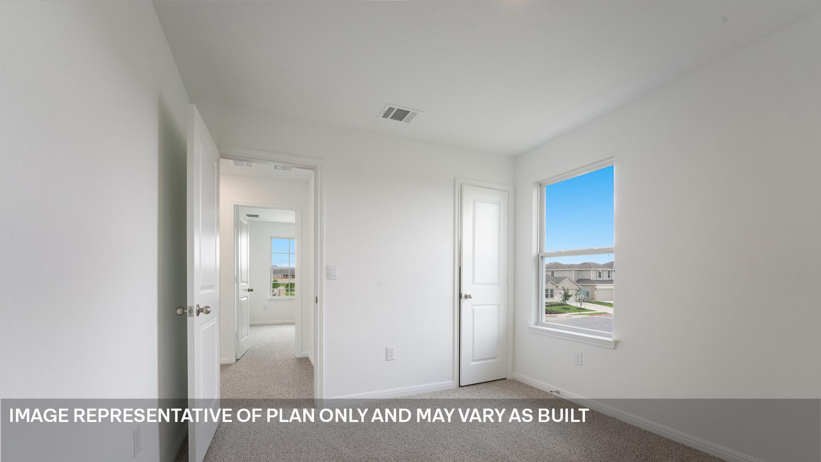 Bedroom 2 with carpeted flooring and window.