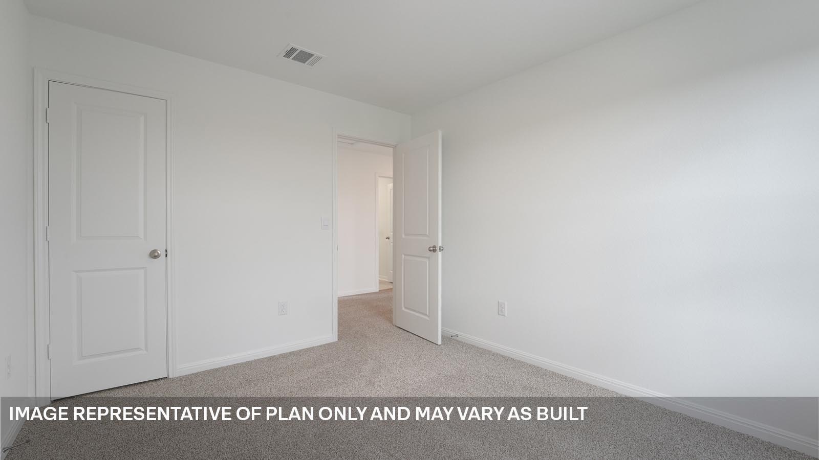 Bedroom 3 with carpeted flooring and window.