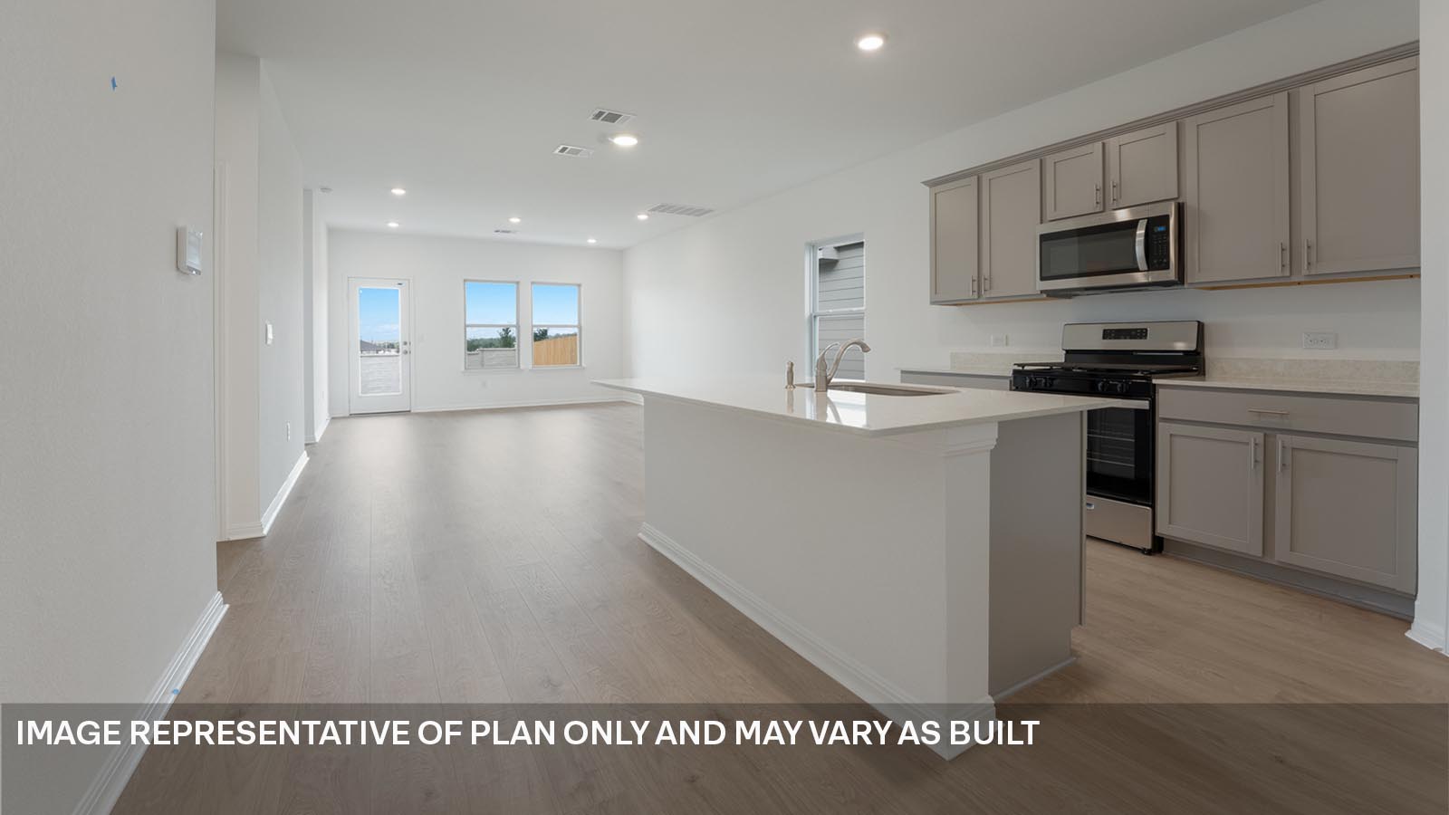 Gourmet kitchen with stainless steel appliances and quartz countertops.