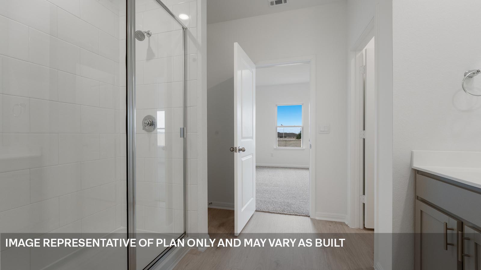 Walk-in shower in primary bathroom.