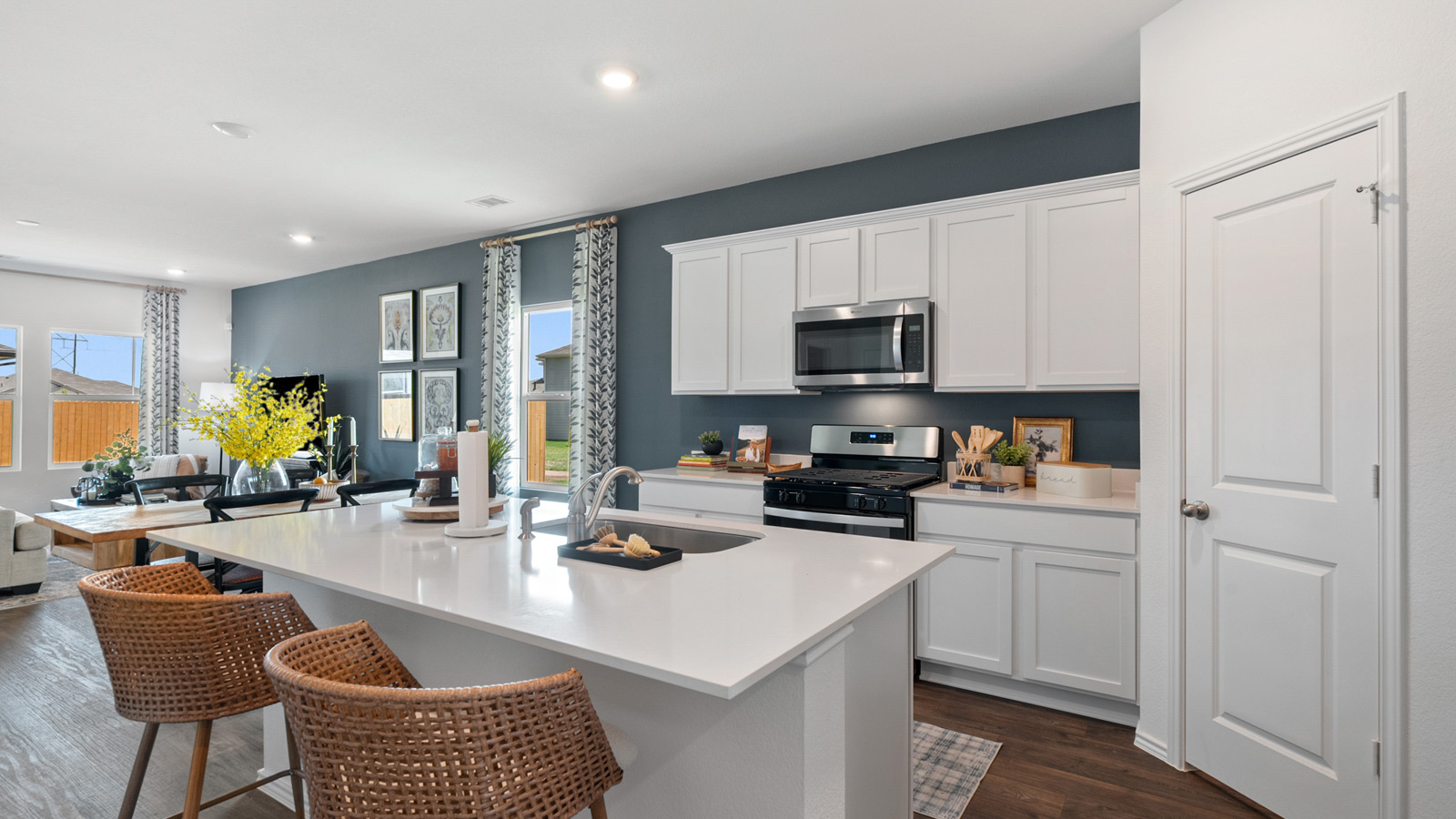 Kitchen with an island, barstool seating, and a walk-in pantry