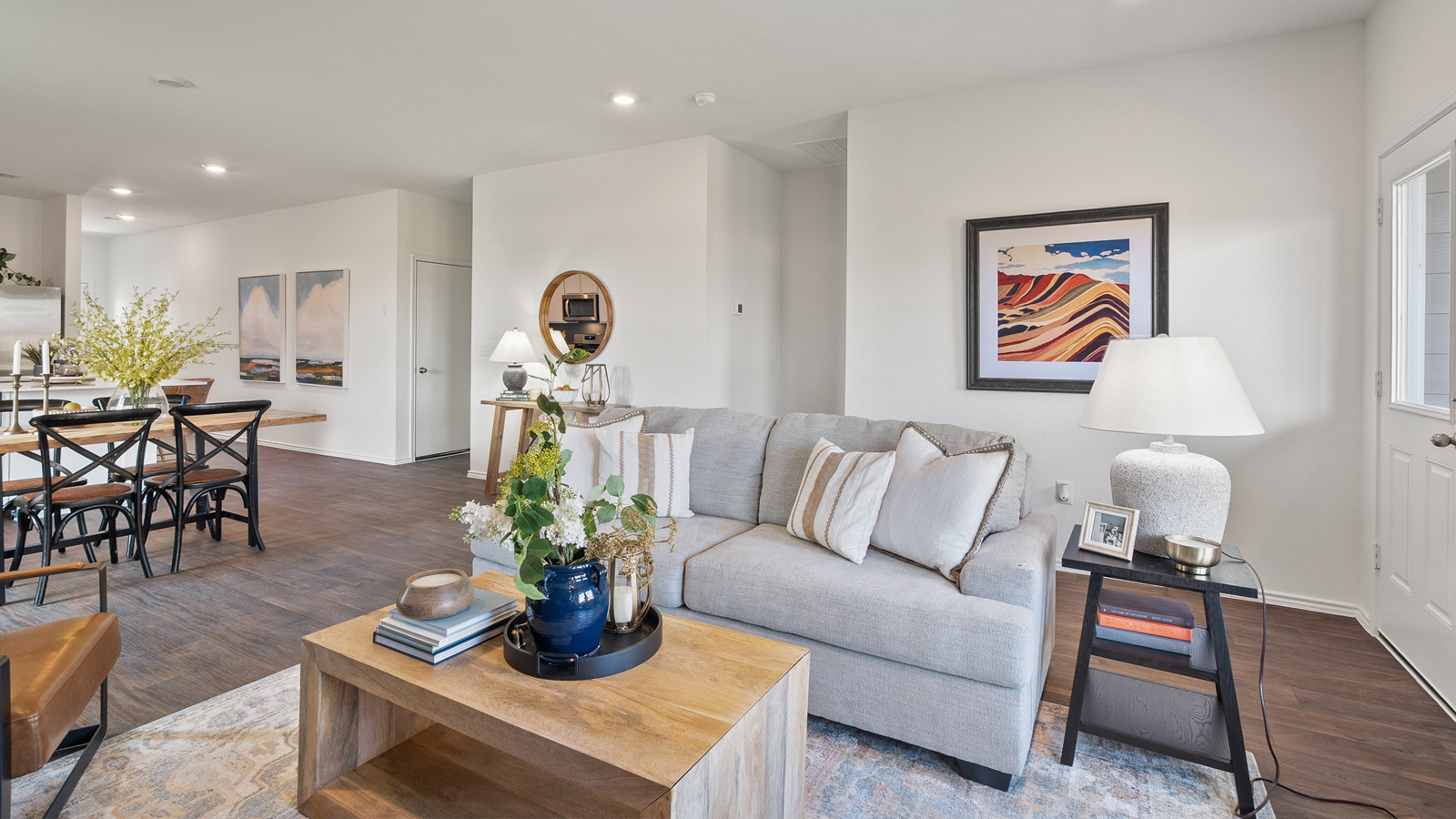 Bright living room furnished with a gray sofa and a wooden coffee table