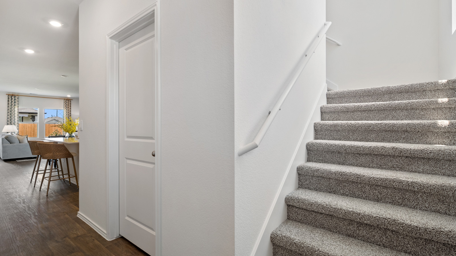Entryway with carpeted staircase