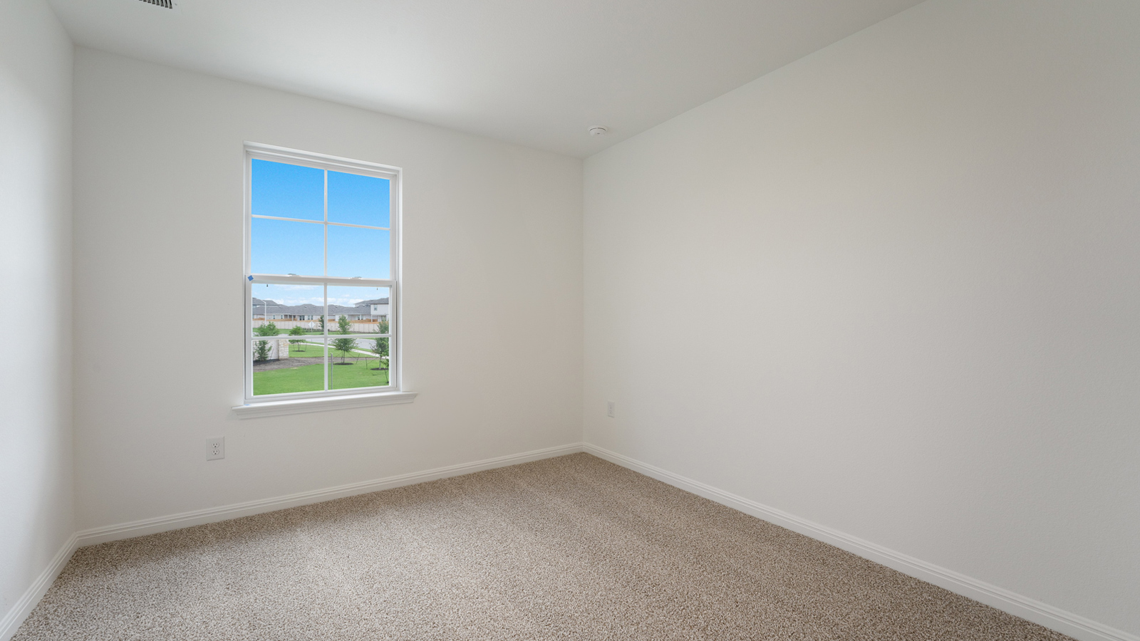 Bedroom 3 with carpeted floors and windows.