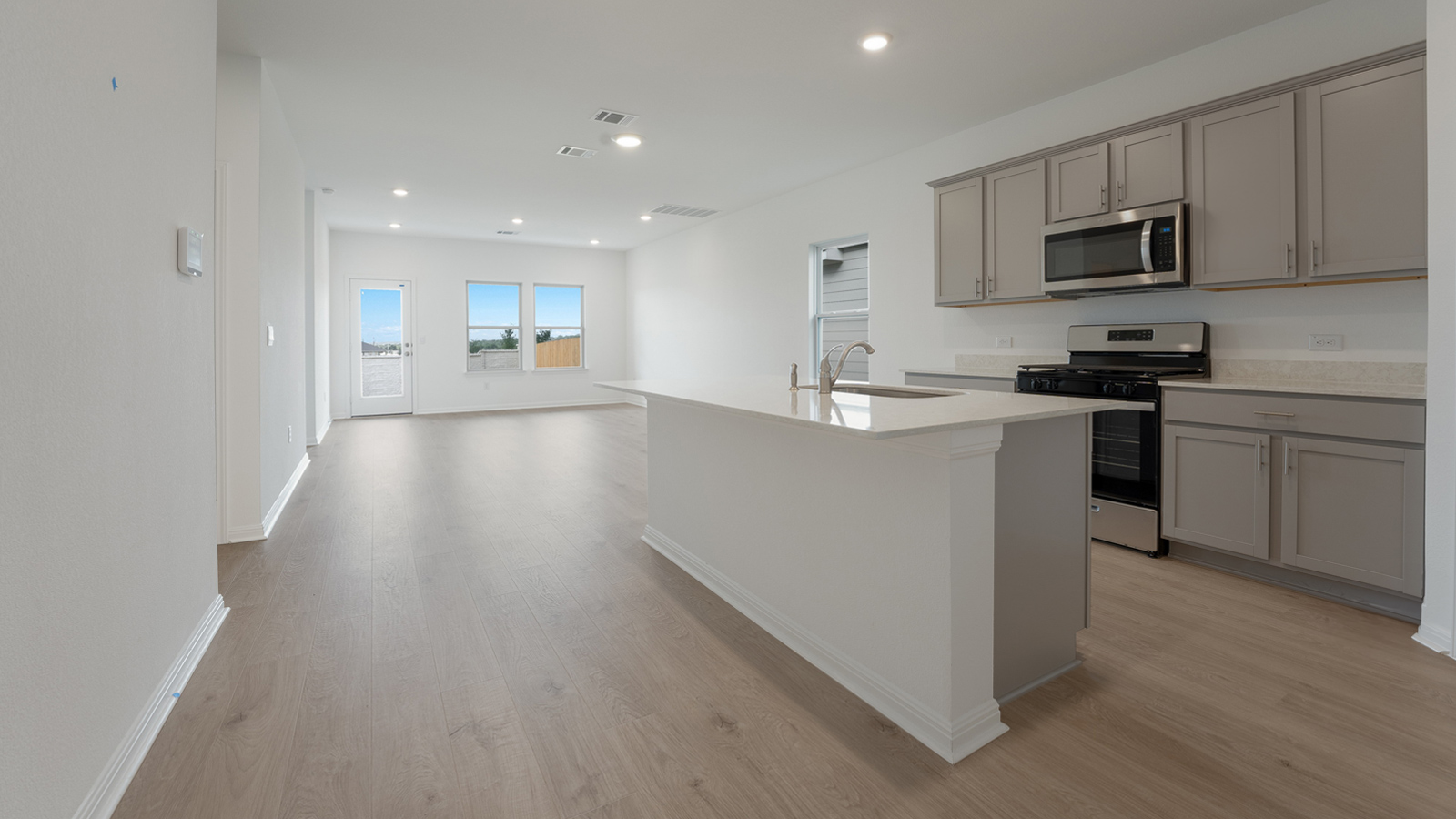 Gourmet kitchen with stainless steel appliances and granite or silestone countertops.