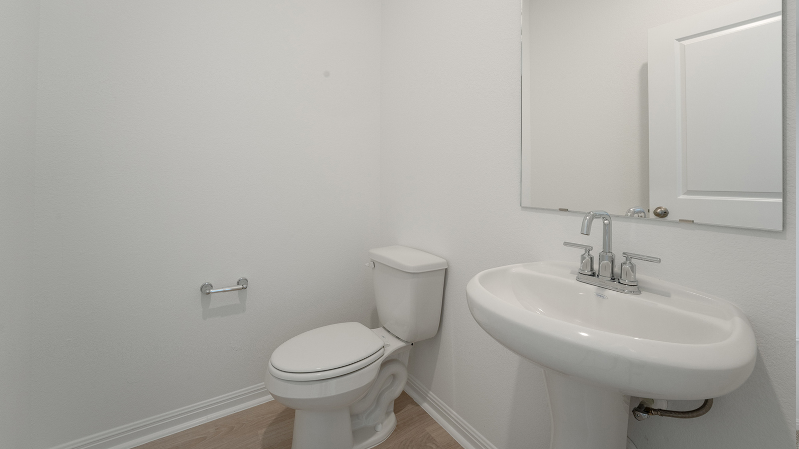 Downstairs powder bathroom off the entryway.