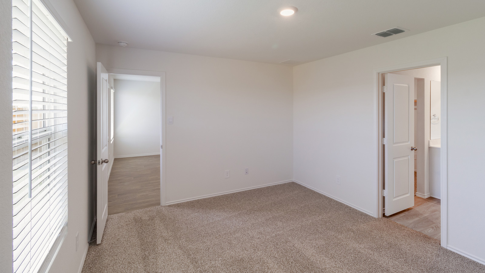 D.R. Horton’s New Home features a calm oasis, functional primary bedroom, walk-in closet, en-suite bath with recessed lighting.