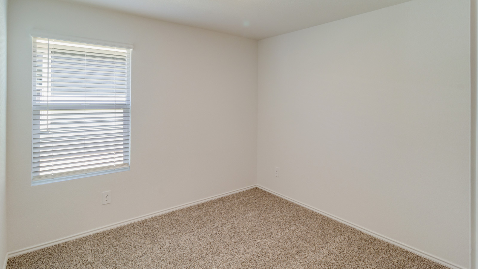 Secondary Bedroom in this New Home includes stellar carpet, bright window light, closet, ideal for guest or child use