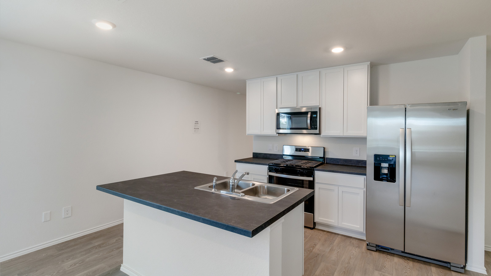 New Home living room includes soft carpet, Modern Design elements, and functional wall space for flexible layouts