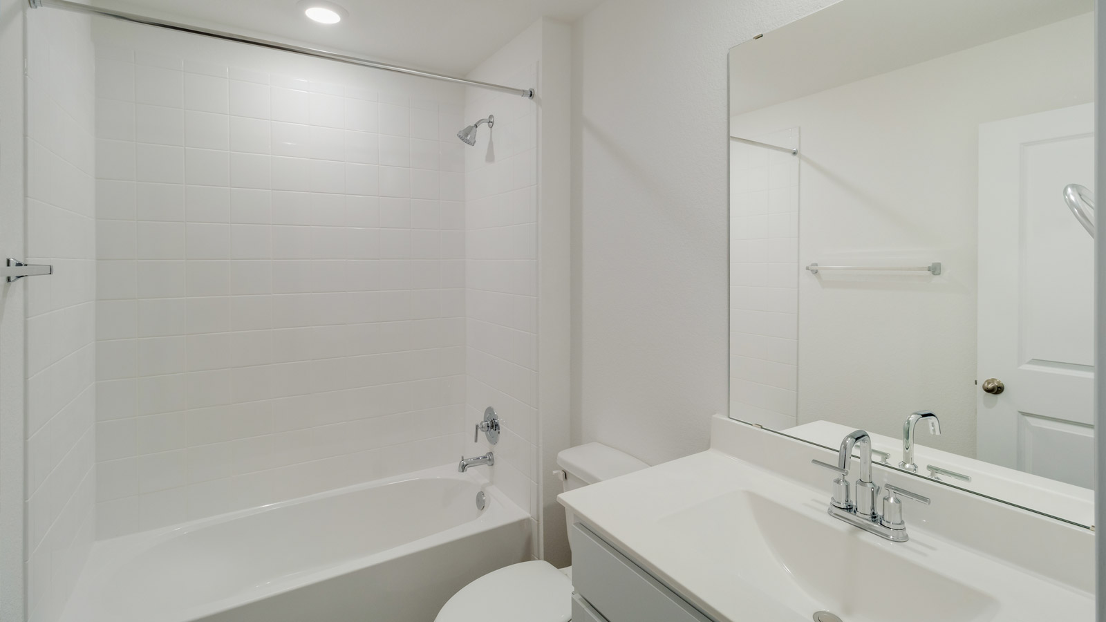bathroom with a vanity sink, toilet and shower