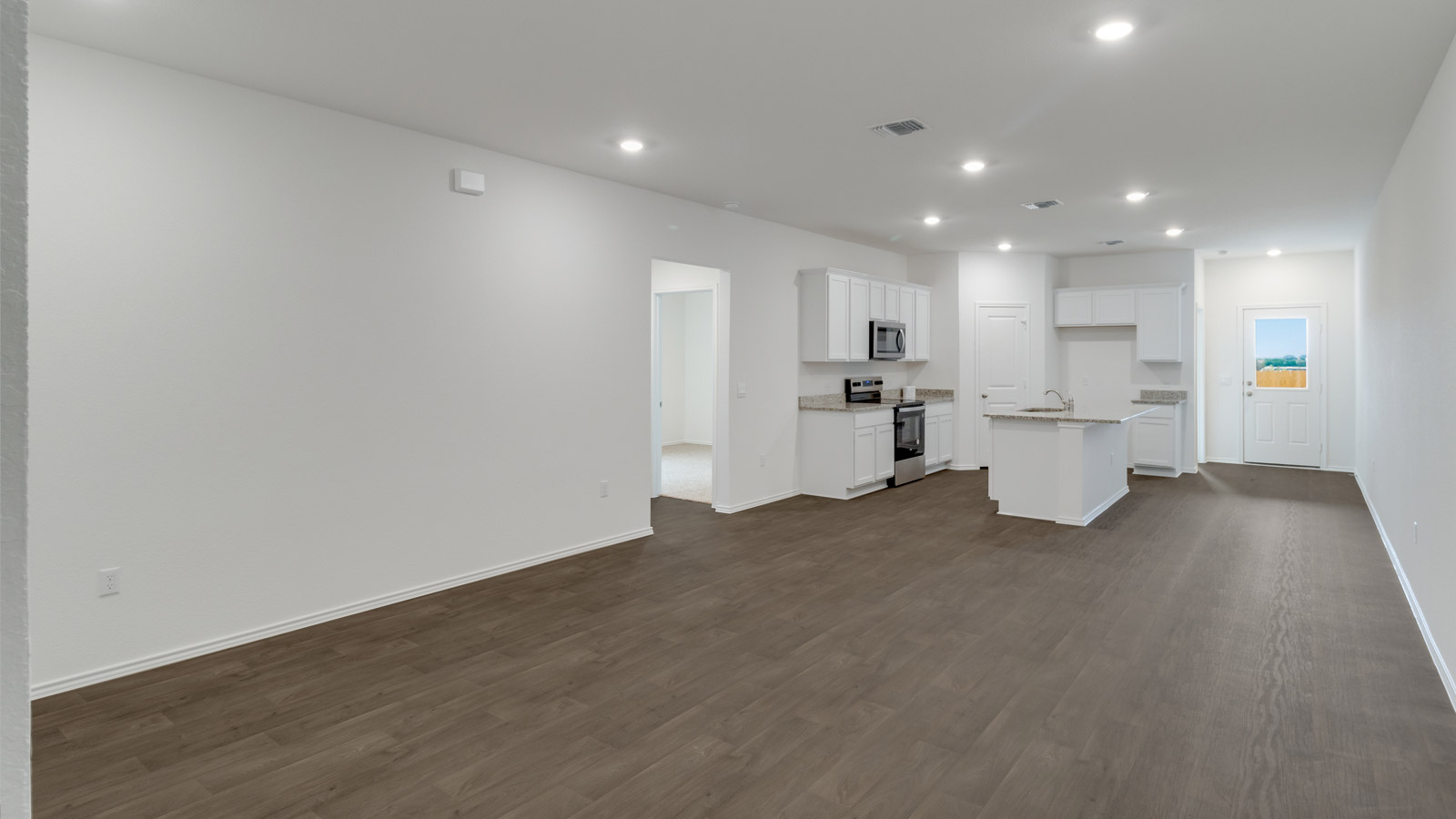 Open concept first floor with the living room, dining room and kitchen next to each other