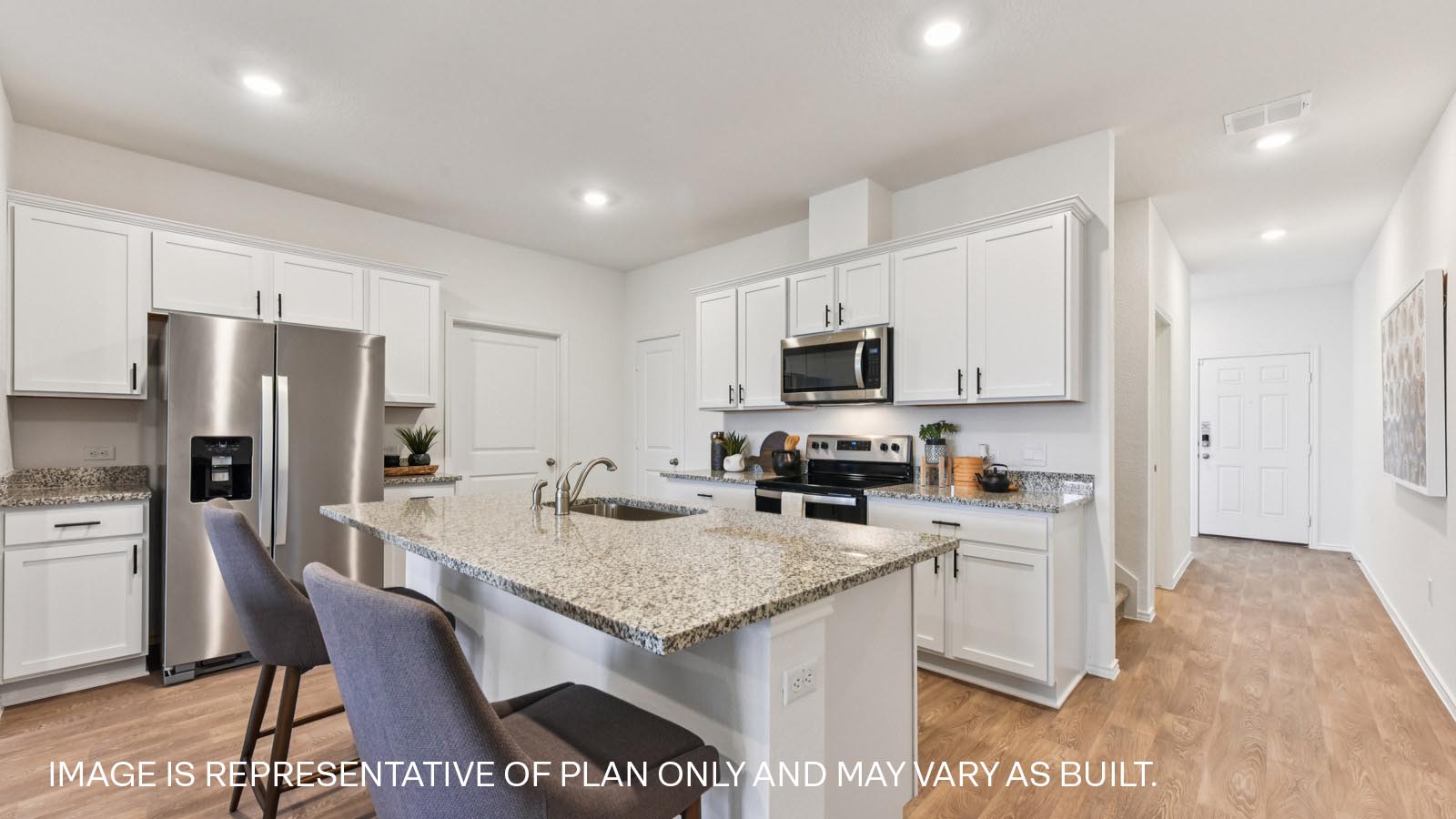 Kitchen with granite countertops and 36" upper cabinets with hardware.