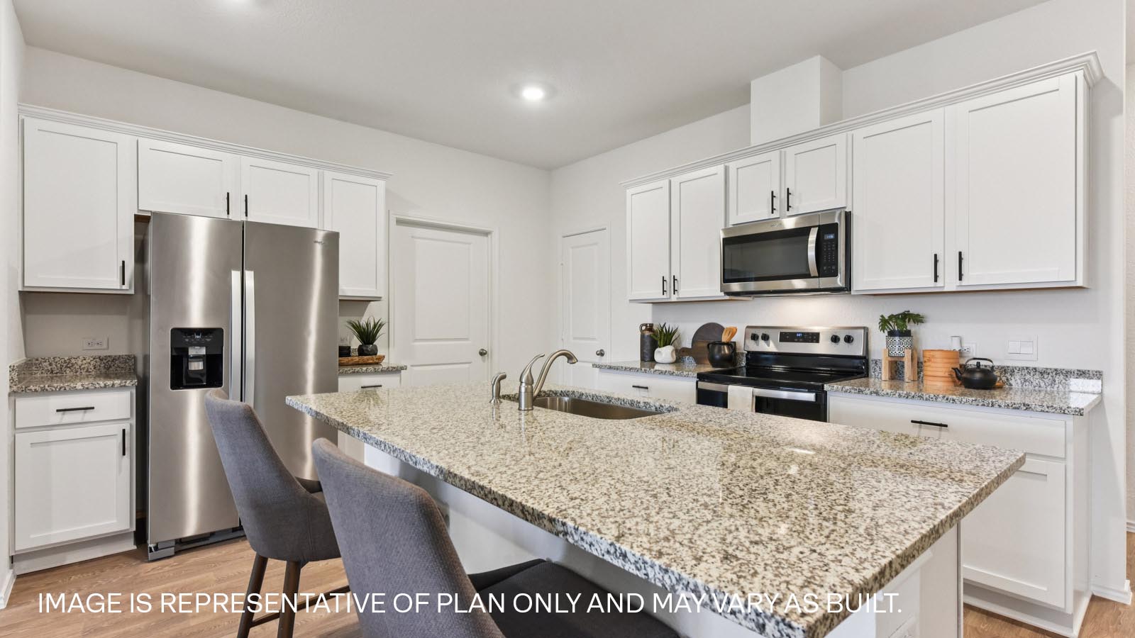 Kitchen with granite countertops and 36" upper cabinets with hardware.
