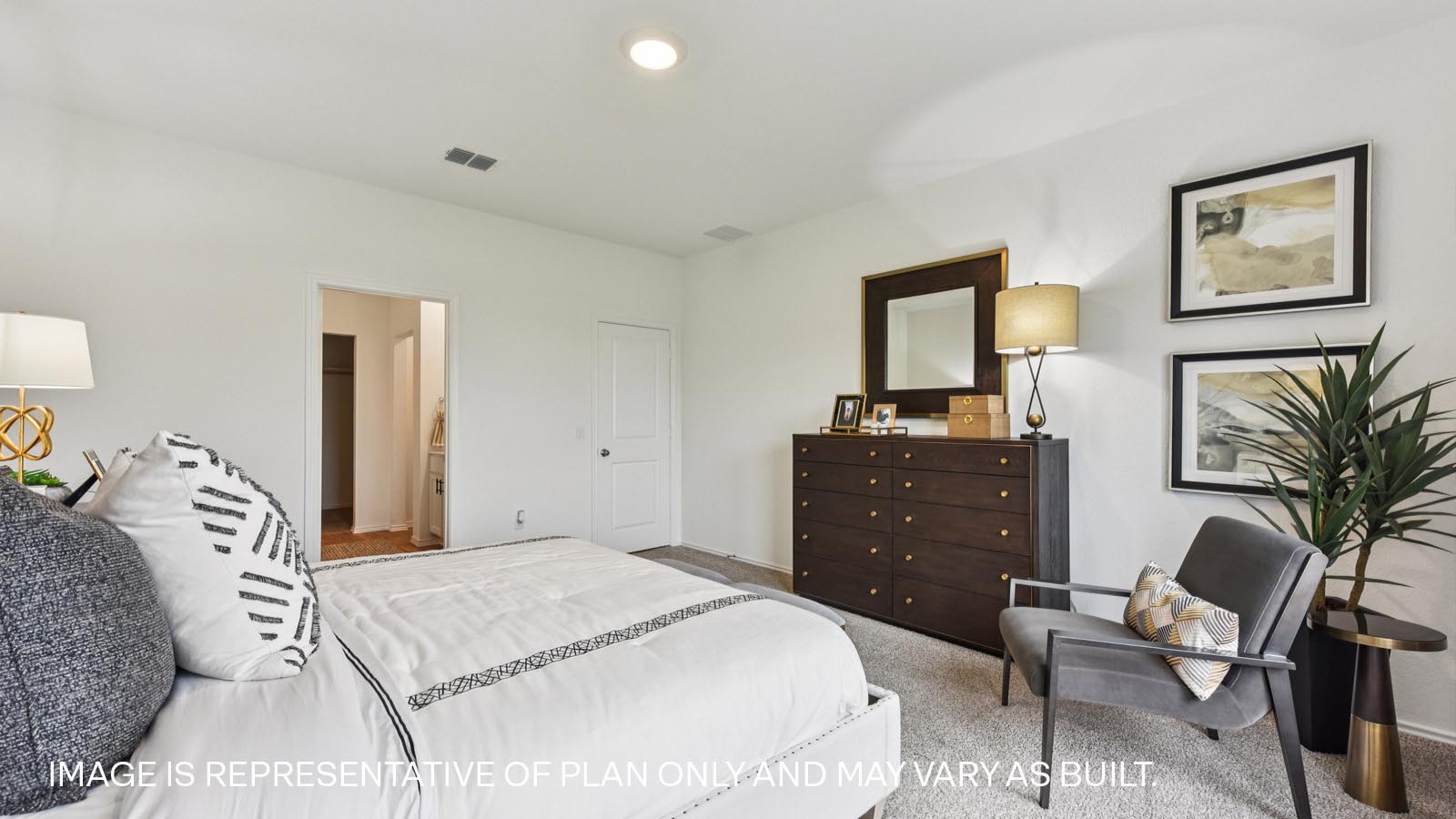 Main bedroom with carpeted flooring and large windows.
