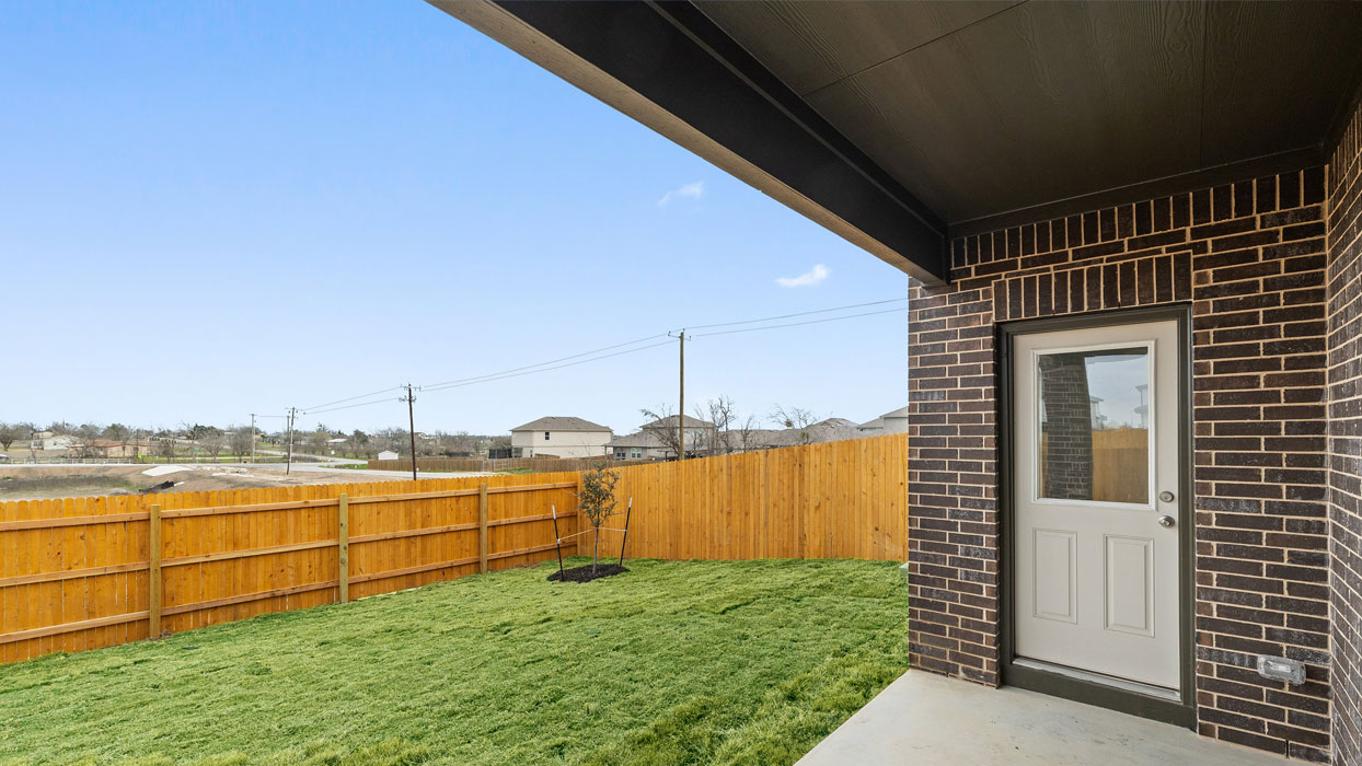 1946 Pecan Floorplan covered back patio gallery image - Palomino in Manor TX