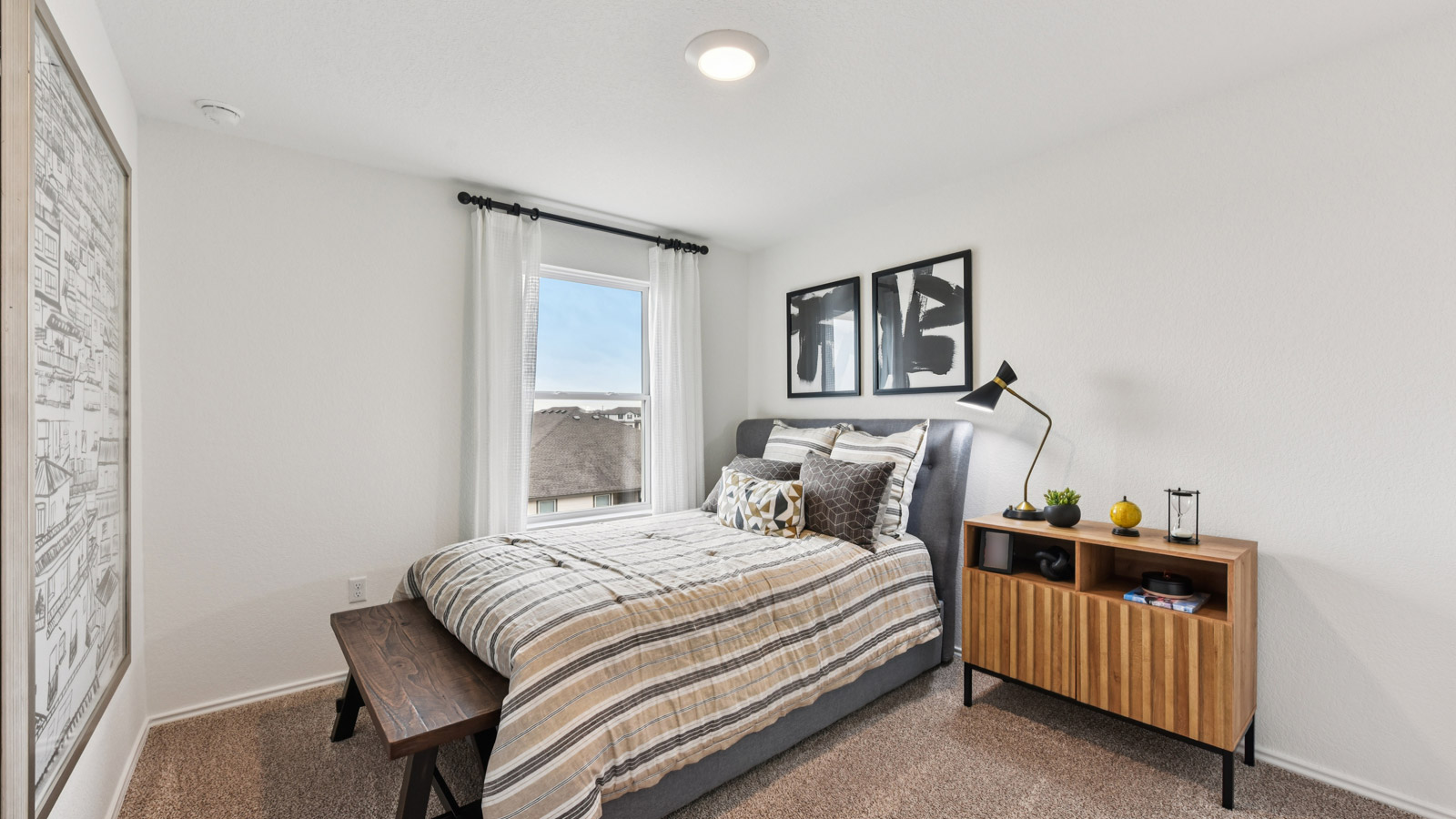 Bedroom 3 with carpeted flooring and window.