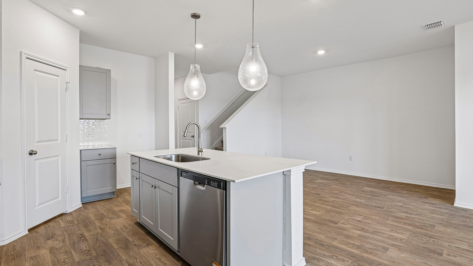 Kitchen with quartz countertops.