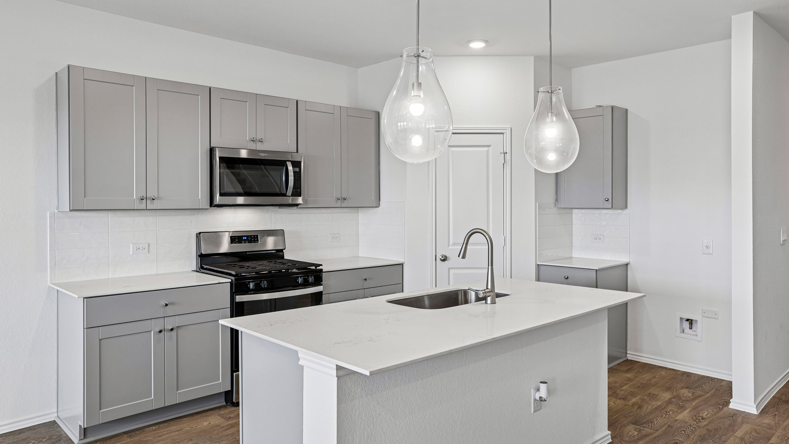 Kitchen with quartz countertops.