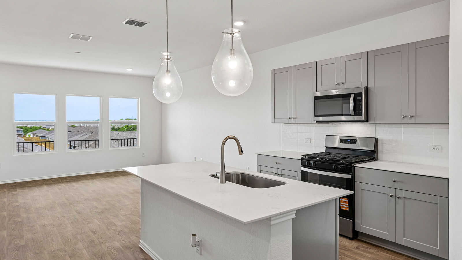 Kitchen with quartz countertops.