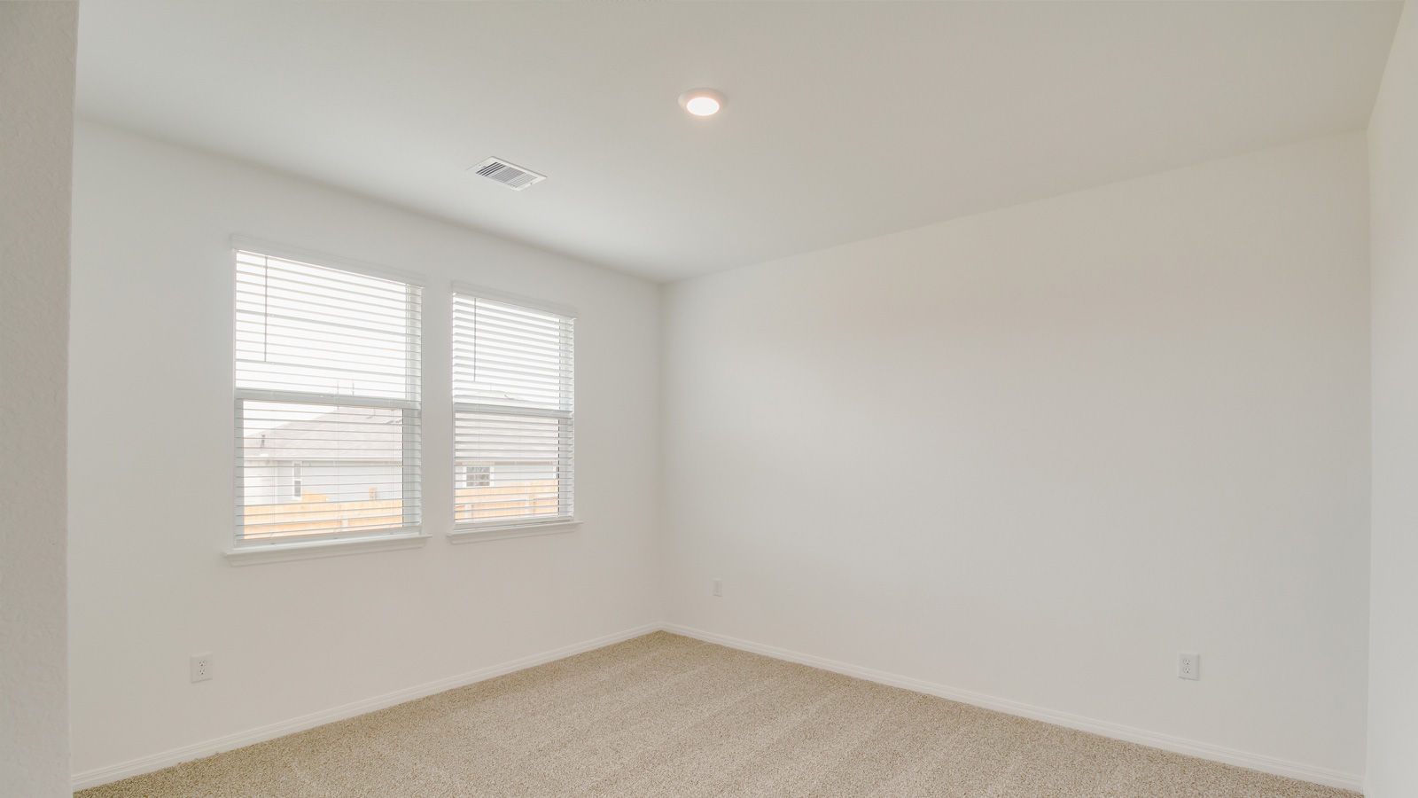 Owner’s suite offers natural window light, spa-inspired ensuite bathroom, backyard view, walk-in closet for everyday style