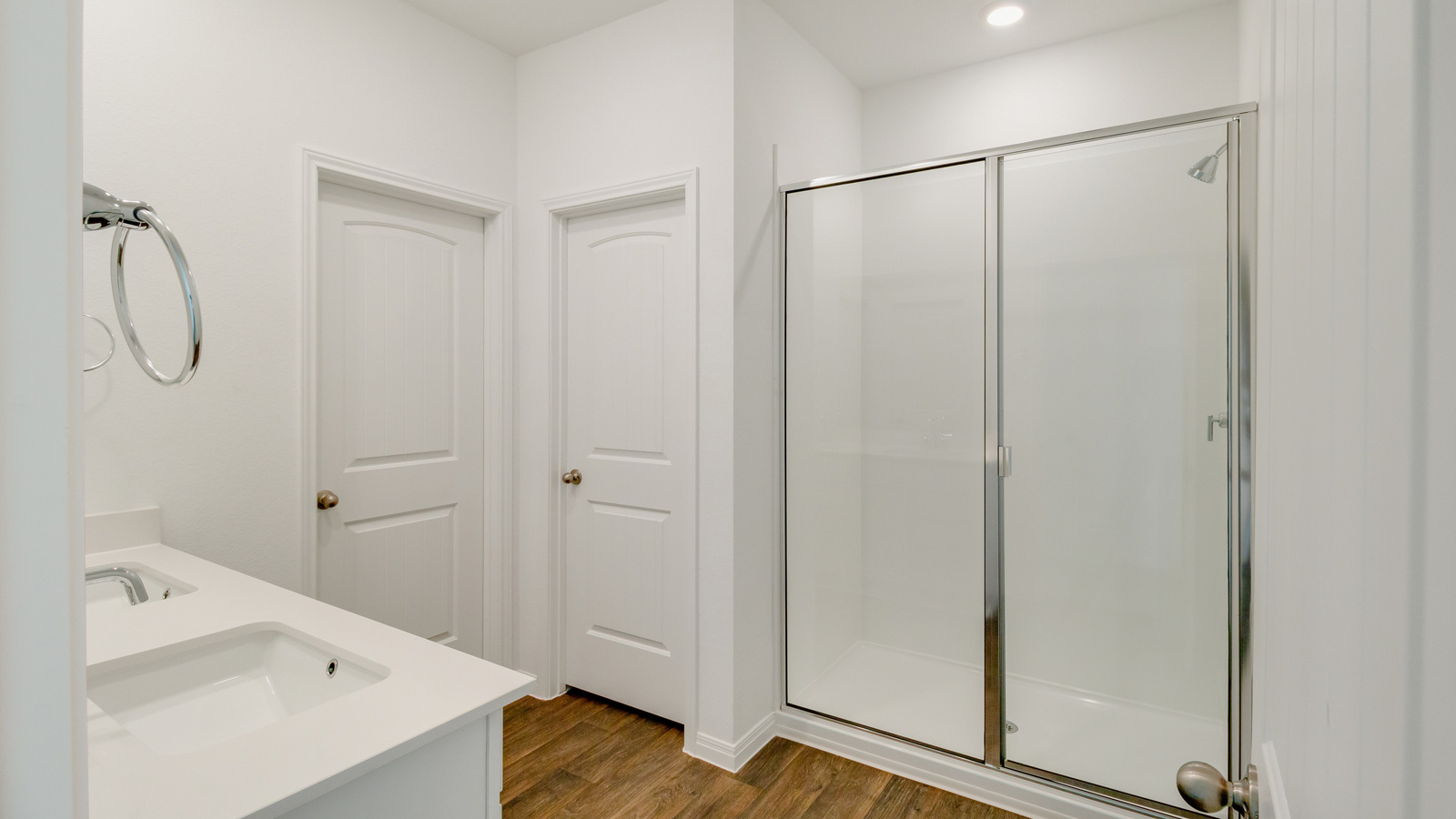 Owner’s ensuite in a new build home offers function and style with a walk-in closet, spa-like ensuite