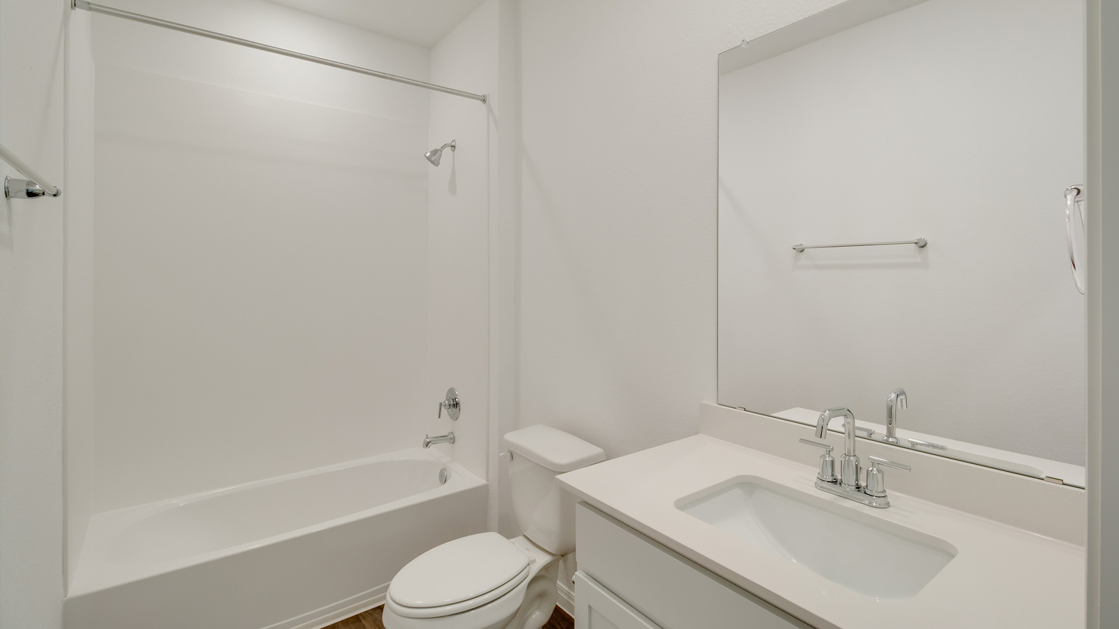 Family full bathroom with stylish vanity, mirror, polished fixtures, cabinets, tub-shower combo in Talavera