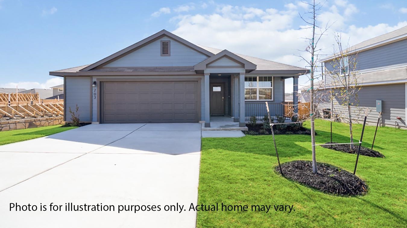 Front exterior of home with two car garage and landscaped front yard