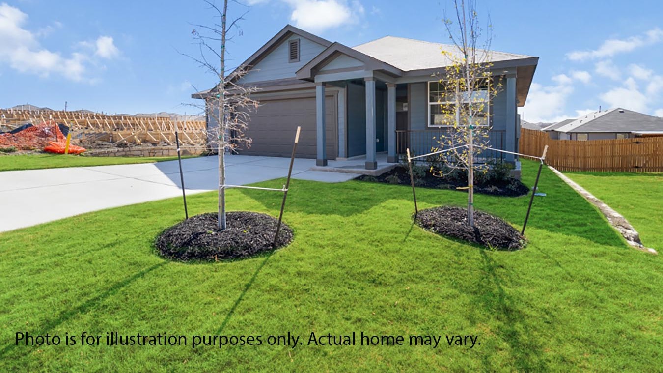 Front exterior of home with two car garage and landscaped front yard