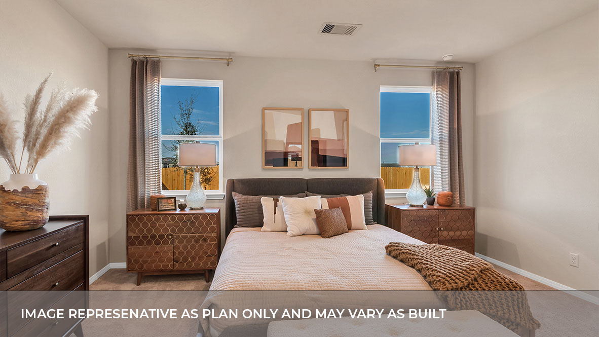 Interior primary bedroom with two windows