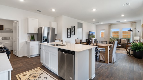 gourmet kitchen with quartz kitchen countertops and stainless steel appliances