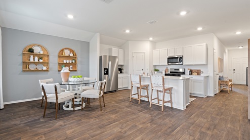 open concept kitchen and dining area