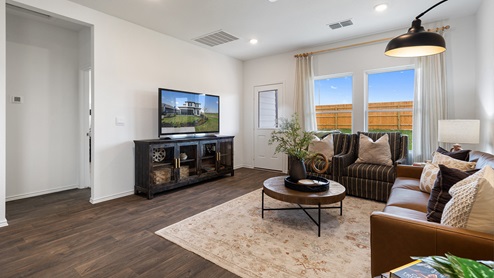 Open concept living room with windows