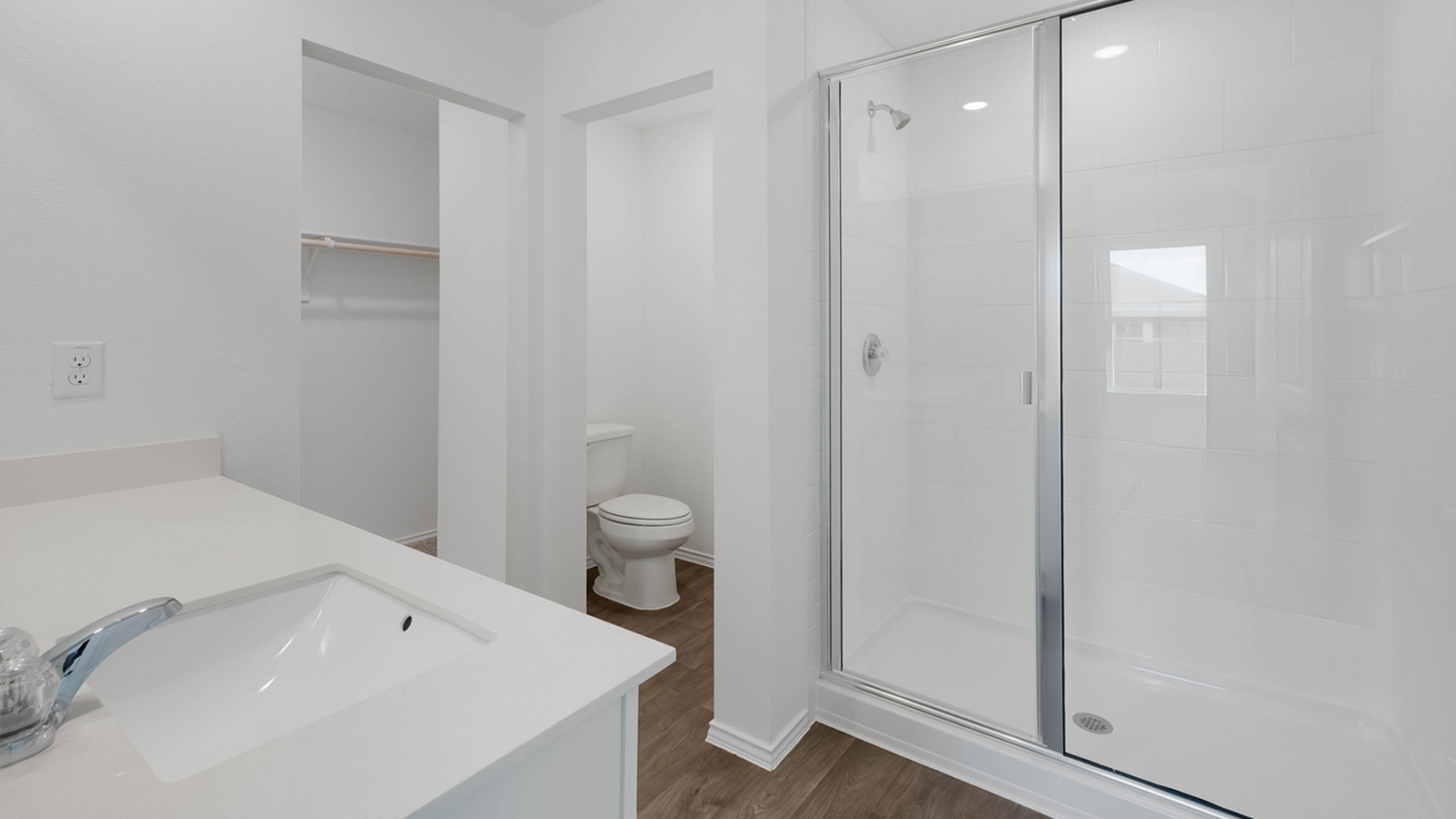 Bathroom 1 with single vanity sink and walk-in shower.