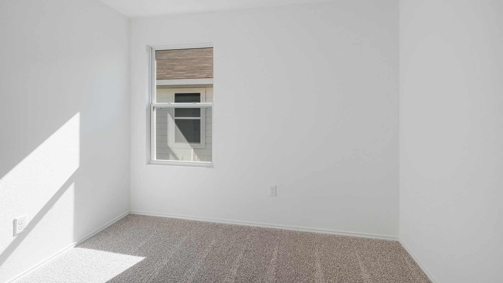 Bedroom 2 with carpeted floors.