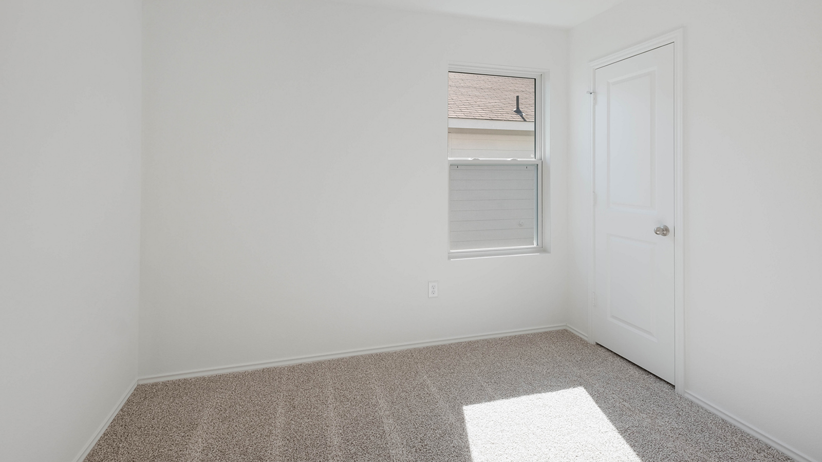 Bedroom 3 with carpeted floors.