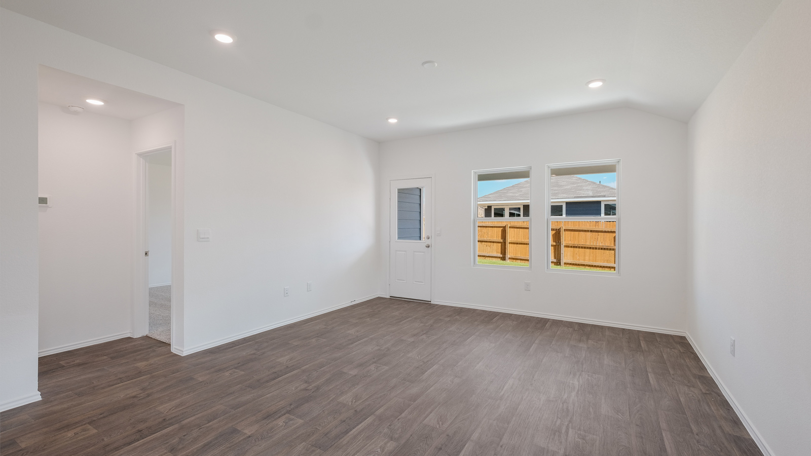 Open concept living room with windows.