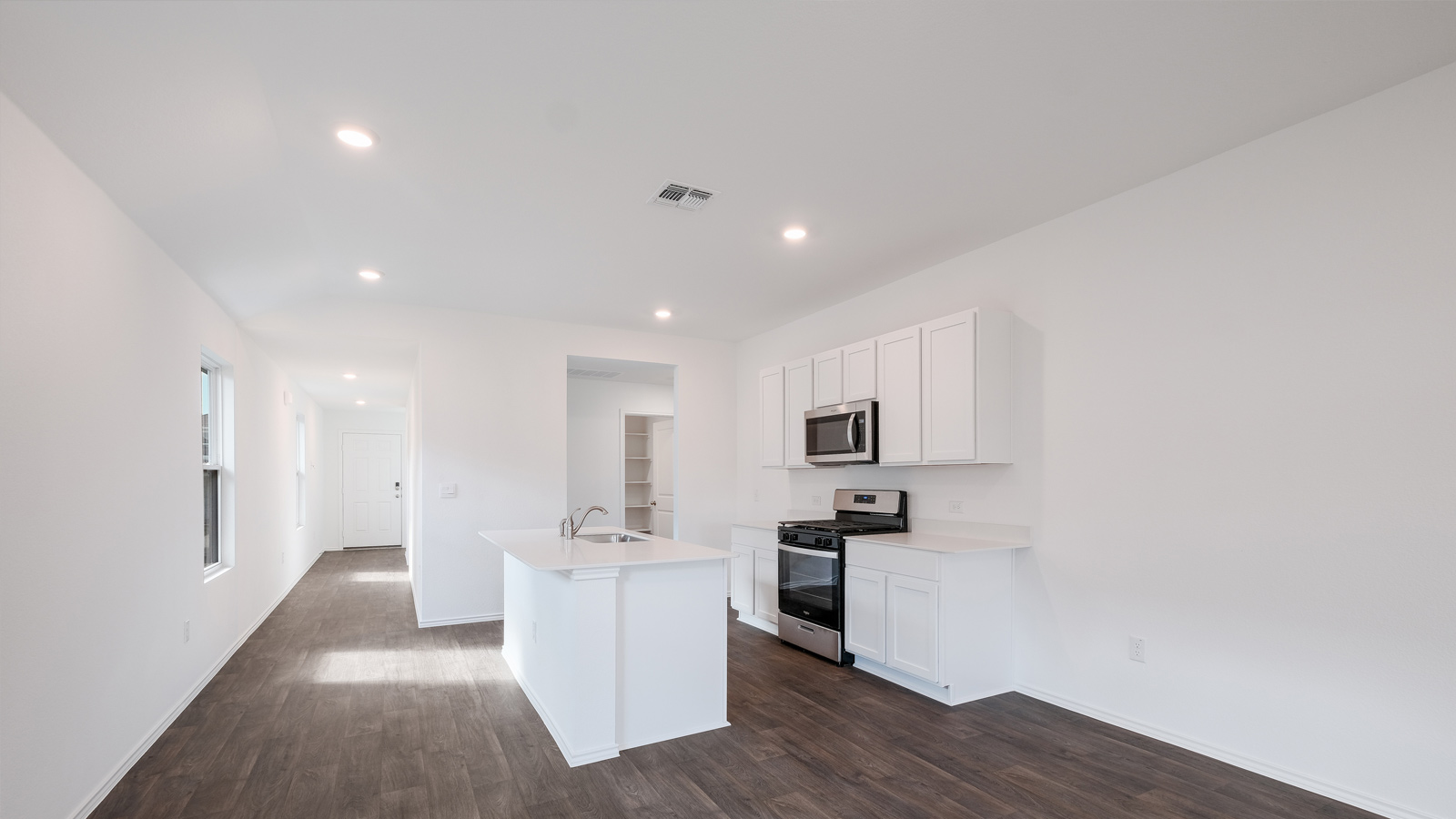 Open concept living room with windows.