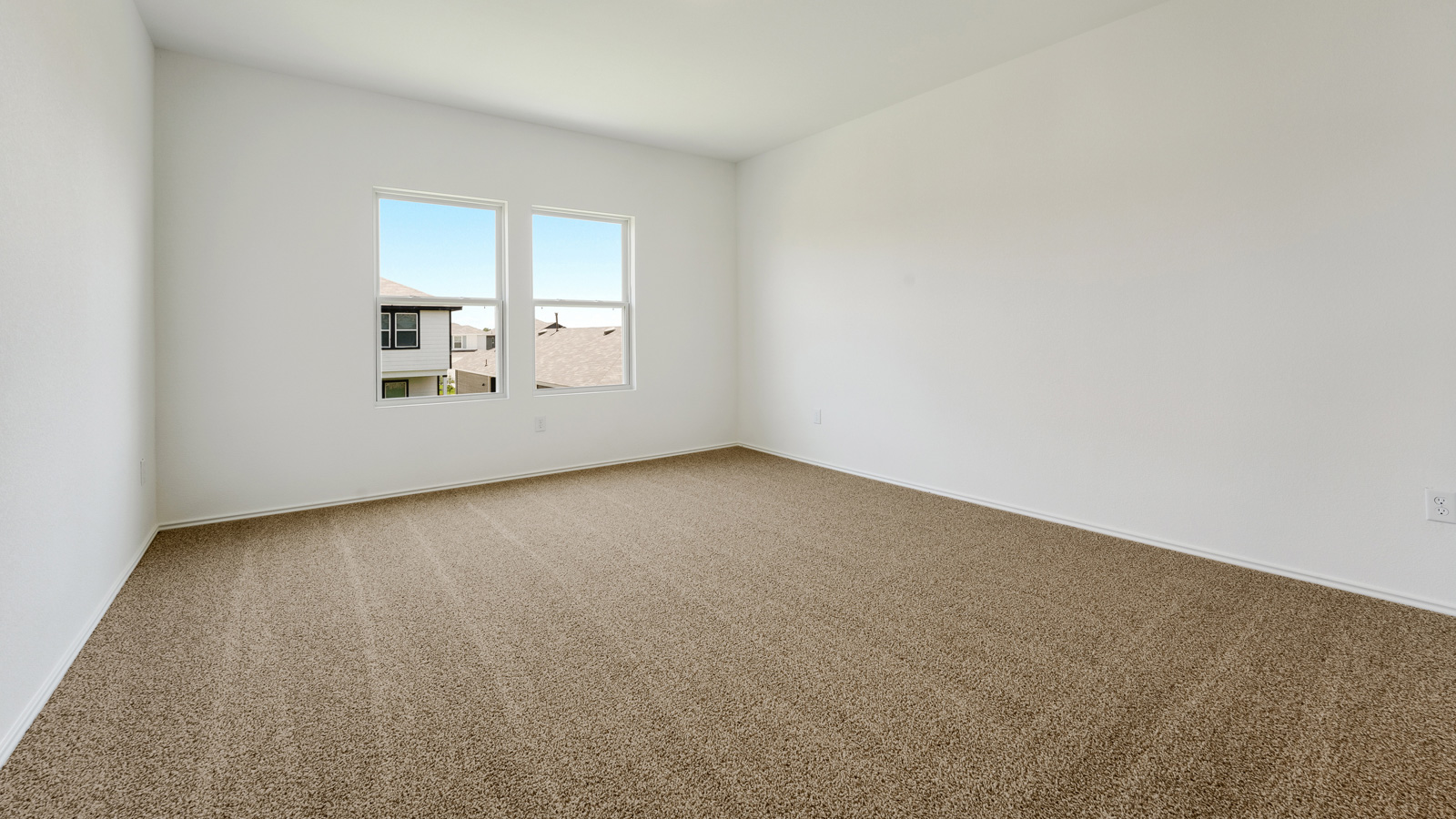 Main bedroom with carpeted floors.