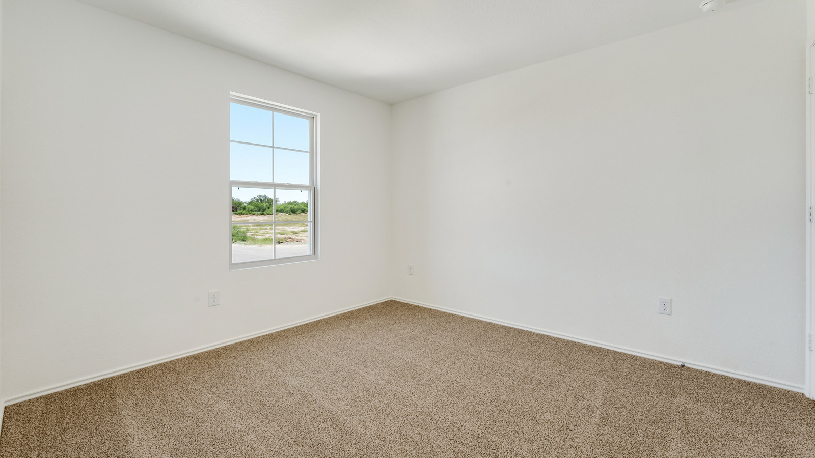 Bedroom 2 with carpeted floors and closet.