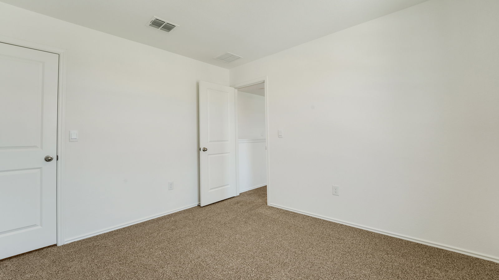 Bedroom 2 with carpeted floors and closet.
