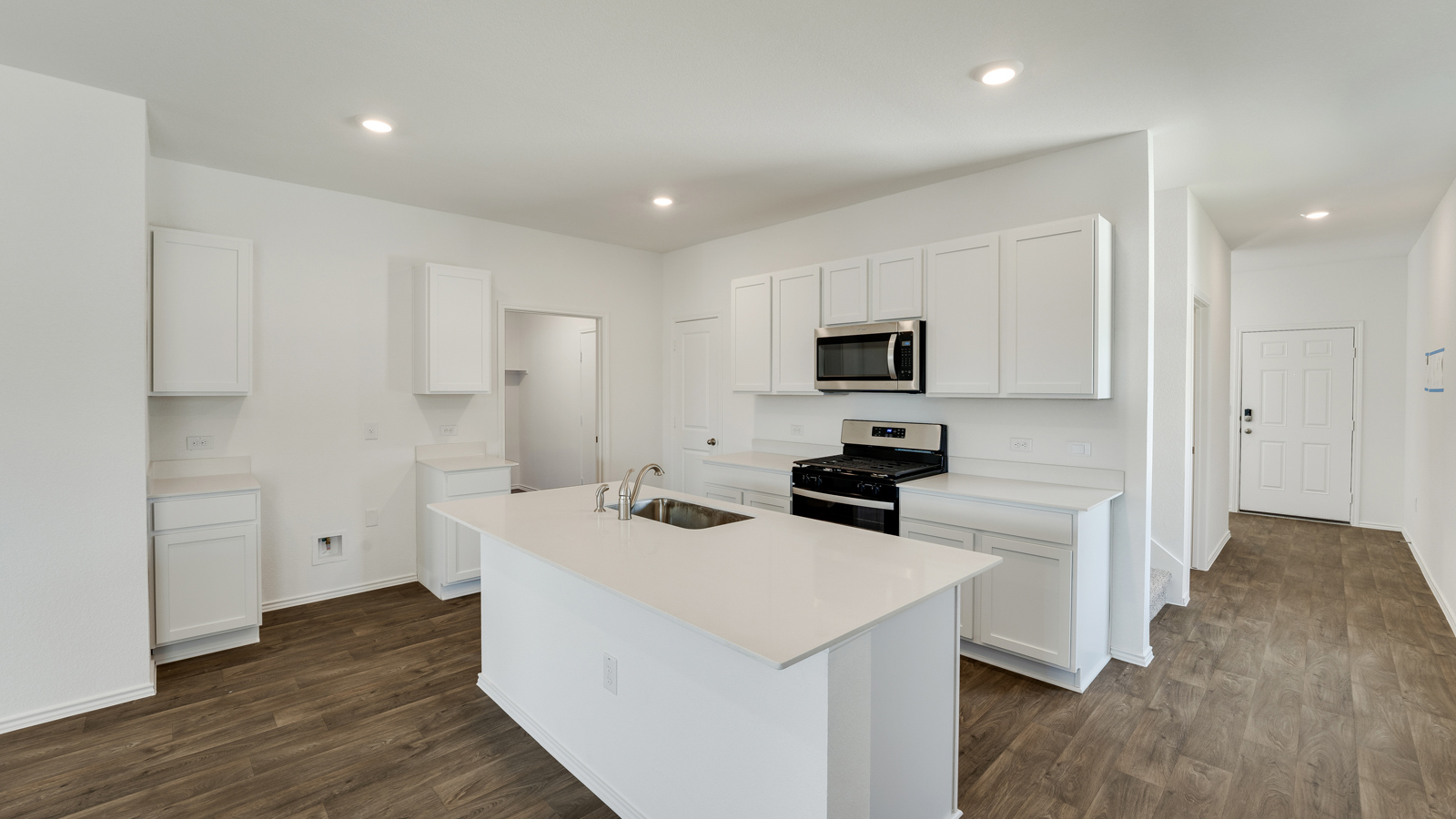 Gourmet kitchen with quartz countertops.