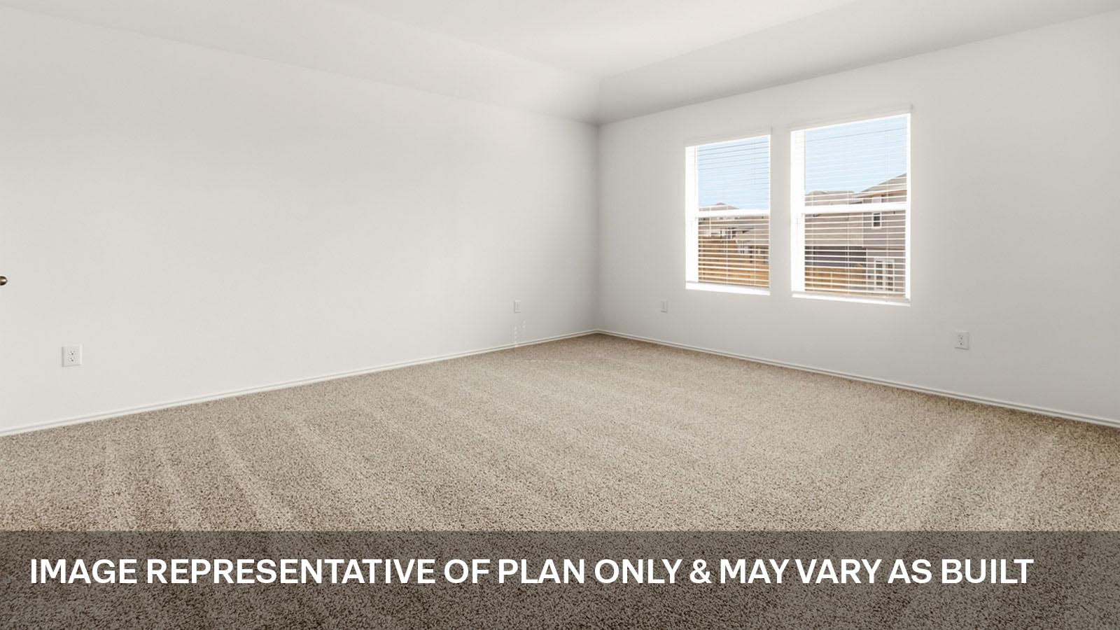 Primary bedroom with carpeted flooring.