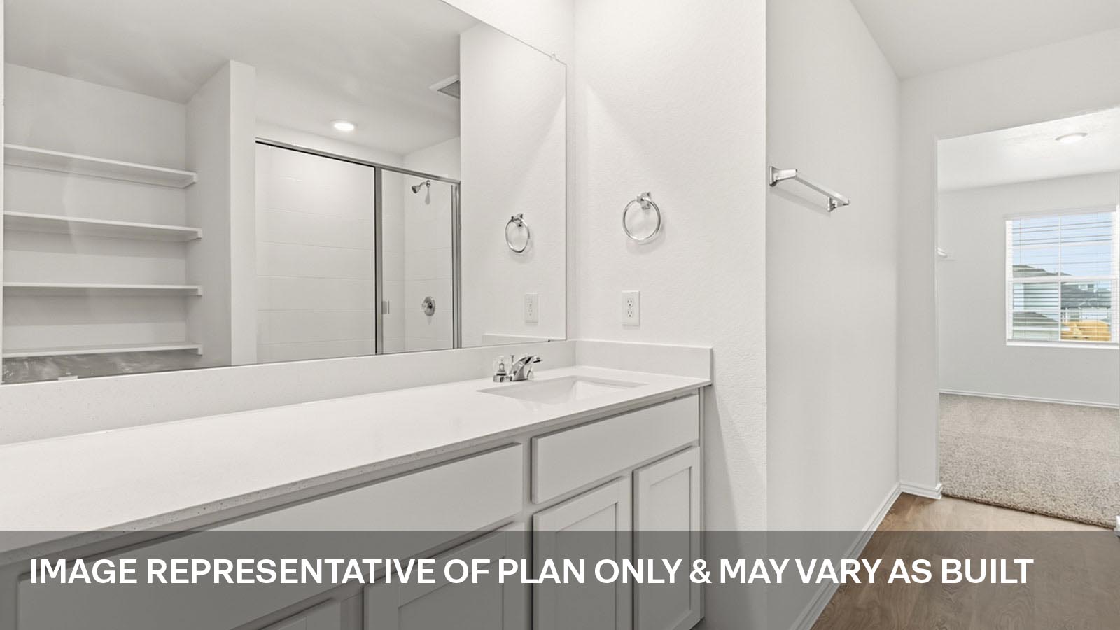 Primary bathroom with quartz countertops and walk-in shower.