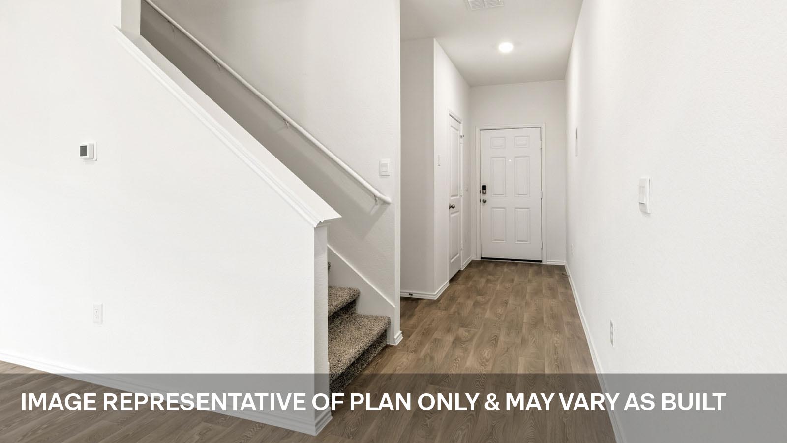 Entryway with vinyl flooring.