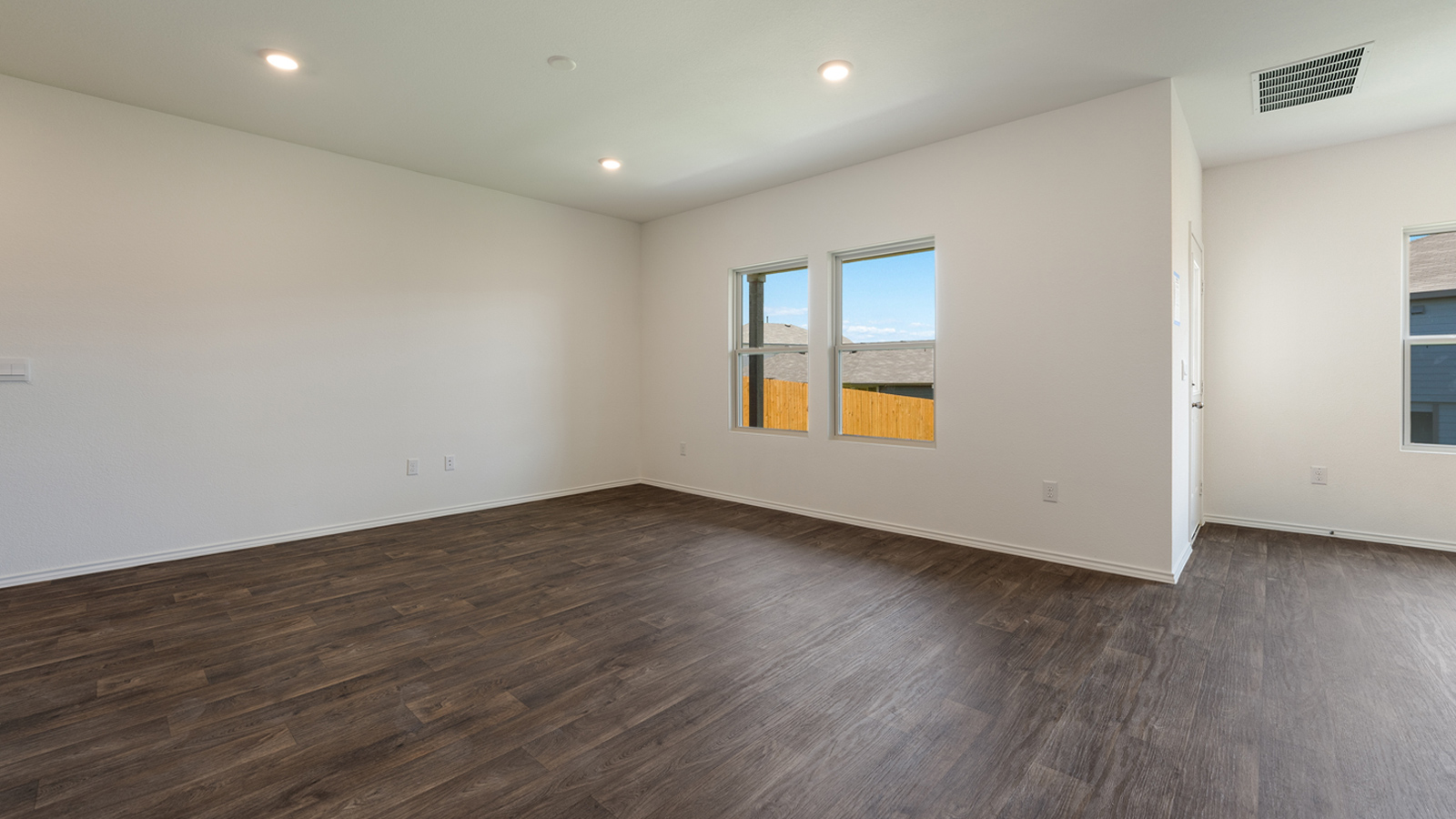 Living area with windows that let in natural light.