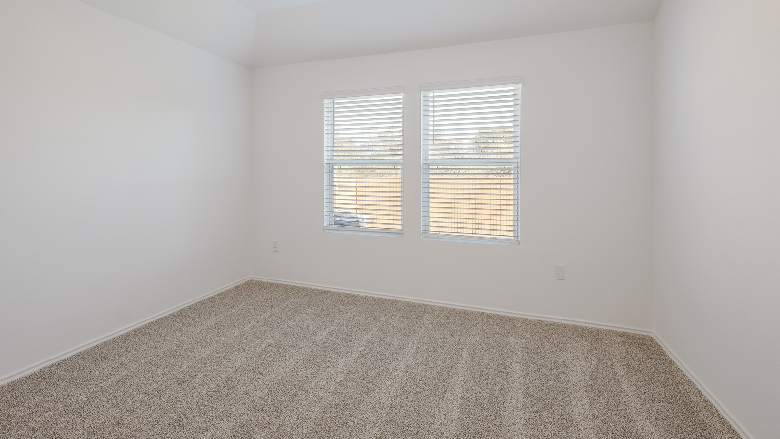Bedroom 1 with large window.