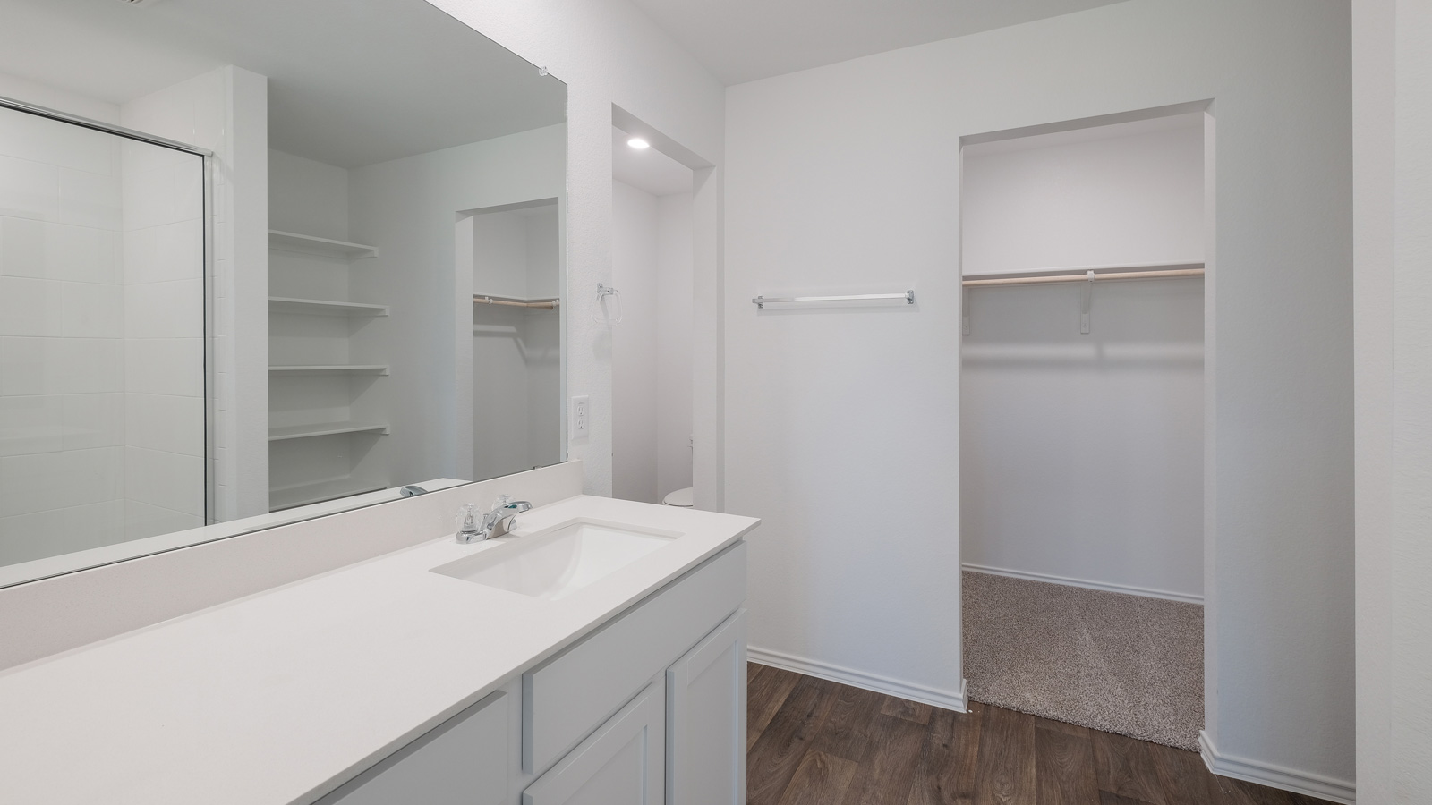 Bathroom 1 with single vanity sink and walk-in shower.